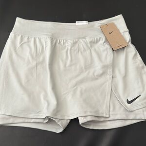 Nike, medium, asymmetrical tennis skirt with under shorts